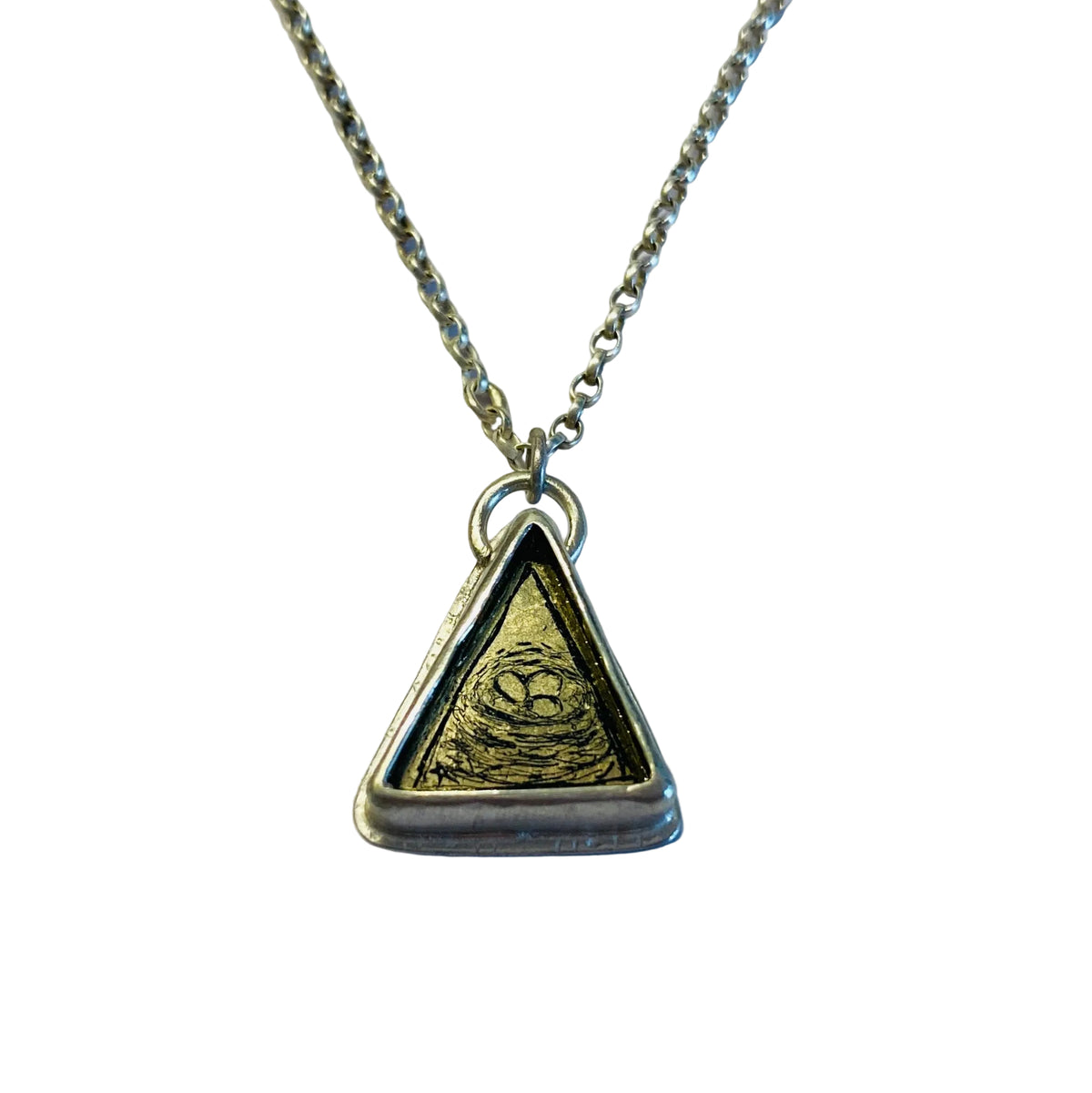 Necklace with a triangular pendant depicting a birds nest with eggs.